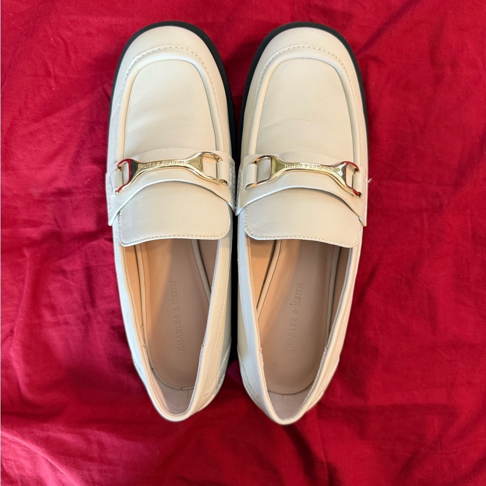 Charles and Keith Cream Loafers with Gold Accent
